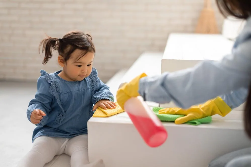 Asian mommy baby daughter cleaning using detergent home
